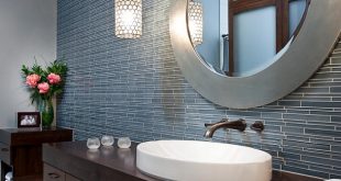 bathroom with round creative vanity mirrors
